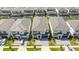 Aerial view of community with multiple two-story houses, pools, and driveways at 6240 Sand Skipper Rd, Orlando, FL 32821