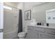 Clean bathroom with gray vanity and bathtub shower combo at 6240 Sand Skipper Rd, Orlando, FL 32821