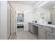 Bright bathroom with double vanity and shower at 6240 Sand Skipper Rd, Orlando, FL 32821
