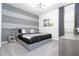 Modern bedroom with gray platform bed and stylish decor at 6240 Sand Skipper Rd, Orlando, FL 32821