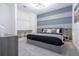 Spacious bedroom with gray platform bed and built-in shelves at 6240 Sand Skipper Rd, Orlando, FL 32821