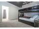 Bedroom with bunk beds and adjacent bathroom at 6240 Sand Skipper Rd, Orlando, FL 32821