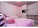 Barbie themed bedroom with closet and TV at 6240 Sand Skipper Rd, Orlando, FL 32821