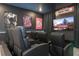 Spacious home theater with comfortable seating and large screen at 6240 Sand Skipper Rd, Orlando, FL 32821