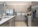 Modern kitchen with stainless steel appliances and island at 6240 Sand Skipper Rd, Orlando, FL 32821