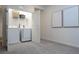 Convenient laundry room with washer, dryer, and shelving at 6240 Sand Skipper Rd, Orlando, FL 32821