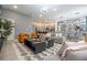 Open concept living area with gray sofas and a modern coffee table at 6240 Sand Skipper Rd, Orlando, FL 32821