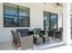 Covered patio with wicker furniture and ceiling fans at 6240 Sand Skipper Rd, Orlando, FL 32821