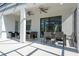 Spacious covered patio with seating and dining areas at 6240 Sand Skipper Rd, Orlando, FL 32821