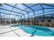 Refreshing screened pool with plenty of lounge space at 6240 Sand Skipper Rd, Orlando, FL 32821