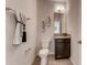 Small powder room with a single sink and granite countertop at 1676 Three Bars Rd, Kissimmee, FL 34744