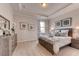 Serene bedroom with a queen-size bed and neutral color palette at 1676 Three Bars Rd, Kissimmee, FL 34744