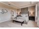 Spacious bedroom with a king-size bed, ensuite bathroom access, and neutral decor at 1676 Three Bars Rd, Kissimmee, FL 34744