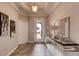 Bright and spacious entryway with tile flooring and a large mirror at 1676 Three Bars Rd, Kissimmee, FL 34744