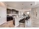 Open kitchen with an island, granite countertops, and dark cabinetry at 1676 Three Bars Rd, Kissimmee, FL 34744