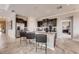 Modern kitchen with dark cabinetry, granite countertops, and stainless steel appliances at 1676 Three Bars Rd, Kissimmee, FL 34744