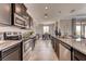 Spacious kitchen with stainless steel appliances and granite countertops at 1676 Three Bars Rd, Kissimmee, FL 34744