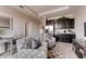 Cozy sitting area with kitchenette and comfortable armchairs at 1676 Three Bars Rd, Kissimmee, FL 34744