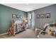 Bedroom with a crib, giraffe toy, and animal-themed decor at 1766 Three Bars Rd, Kissimmee, FL 34744