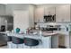 Modern kitchen with island and stainless steel appliances at 1766 Three Bars Rd, Kissimmee, FL 34744