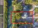 Single-Gathering home situated on a large lot with canal frontage at 27623 Lisa Dr, Tavares, FL 32778