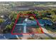 Single-Gathering home with a large backyard, driveway, and canal view at 27623 Lisa Dr, Tavares, FL 32778