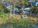 Peaceful backyard with a dock and canal access at 27623 Lisa Dr, Tavares, FL 32778