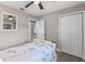 Bright bedroom with double closet and a comfortable bed at 27623 Lisa Dr, Tavares, FL 32778