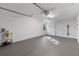 Spacious garage with painted floor and ample storage at 27623 Lisa Dr, Tavares, FL 32778