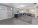 Spacious living room featuring gray sofas, a coffee table, and stylish decor at 27623 Lisa Dr, Tavares, FL 32778