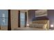 Bedroom with a king-size bed, nightstands, and accent wall at 4565 Cabello Loop, Kissimmee, FL 34746
