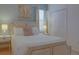 Bedroom with a queen-size bed, nightstands, and window with blinds at 4565 Cabello Loop, Kissimmee, FL 34746