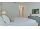 Bedroom with a king-size bed, dresser, and access to hallway at 4565 Cabello Loop, Kissimmee, FL 34746