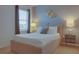 Relaxing bedroom with a double bed, nightstands, and tasteful wall art at 4565 Cabello Loop, Kissimmee, FL 34746