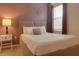 Cozy bedroom featuring a double bed, nightstands, and decorative wall art at 4565 Cabello Loop, Kissimmee, FL 34746