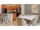 Dining area with a marble table and six brown chairs at 4565 Cabello Loop, Kissimmee, FL 34746