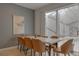 Bright dining room with a white table and access to a pool at 4565 Cabello Loop, Kissimmee, FL 34746