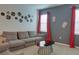 Gathering room with sectional sofa and movie theme decor at 4565 Cabello Loop, Kissimmee, FL 34746