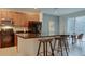 Kitchen boasts dark wood cabinets and granite countertops at 4565 Cabello Loop, Kissimmee, FL 34746