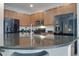 Modern kitchen with granite island and stainless steel appliances at 4565 Cabello Loop, Kissimmee, FL 34746