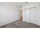 Bright bedroom with double door closet and carpet at 6719 Marmalade Aly, Winter Garden, FL 34787