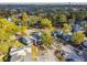 Aerial view of townhouses with ample parking and surrounding nature at 707 Saint Matthew Cir, Altamonte Springs, FL 32714