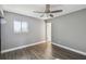 Spacious bedroom with wood-look floors and a ceiling fan at 707 Saint Matthew Cir, Altamonte Springs, FL 32714