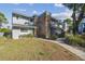 Attractive townhome with gray siding and brick accents, showcasing a well-maintained lawn at 707 Saint Matthew Cir, Altamonte Springs, FL 32714
