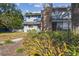 Townhome with gray siding, brick accents, and landscaping at 707 Saint Matthew Cir, Altamonte Springs, FL 32714