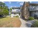 Two-story townhome with a brick facade and walkway at 707 Saint Matthew Cir, Altamonte Springs, FL 32714