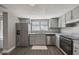 Galley kitchen with stainless steel appliances at 707 Saint Matthew Cir, Altamonte Springs, FL 32714