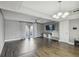 Spacious living room with wood-look floors, a chandelier, and sliding glass doors at 707 Saint Matthew Cir, Altamonte Springs, FL 32714