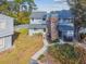 Two-story townhouse with gray siding, brick chimney, and walkway at 707 Saint Matthew Cir, Altamonte Springs, FL 32714