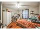 Bedroom with wood flooring, a ceiling fan and window at 722 Eagle Ave, Longwood, FL 32750